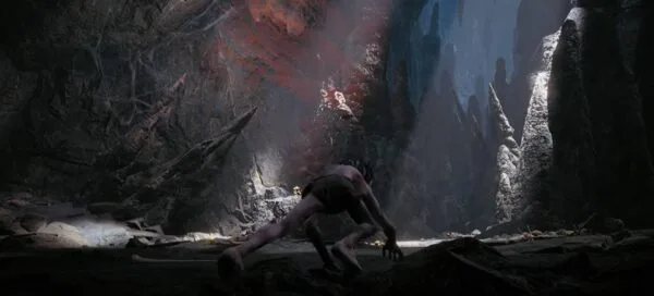 Cena do jogo O Senhor dos Anéis: Gollum, em que o personagem entra em uma caverna escura, como se buscasse algo